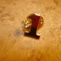 Gold tone #1metal pin badge with white rhinestone.