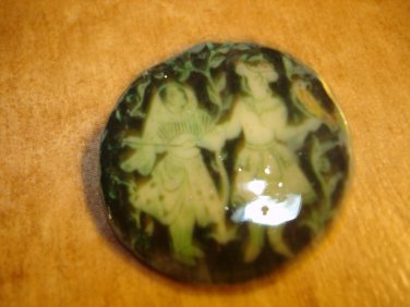 Paper mache button with European dancers signed by artist.