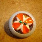 Nicely painted pierced plastic button with rhinestones.