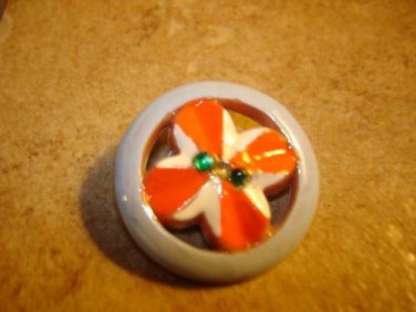 Nicely painted pierced plastic button with rhinestones.