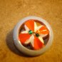 Nicely painted pierced plastic button with rhinestones.