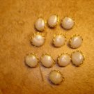 Lot of 11 gold metal and pearl like buttons. Lot of 11 gold metal and pearl like buttons.