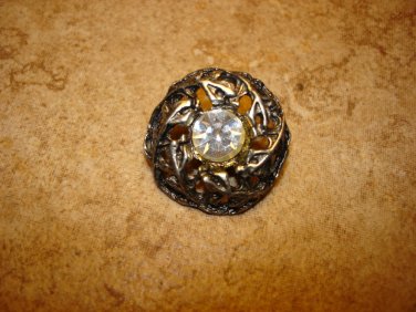 Vintage cut steel pewter button with rhinestone.