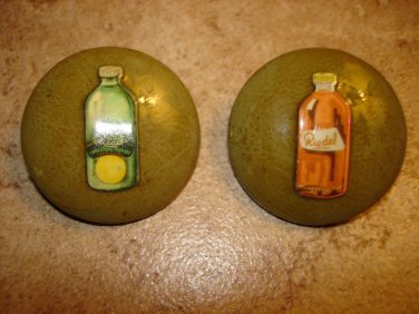 Set of 2 large old celuloid buttons with orange and citrus lemonade.