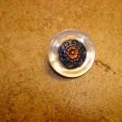 Vintage mother of pearl button with metal flower.