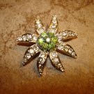 Large flower shape silver metal button with tiny rhinestones.