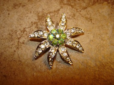 Large flower shape silver metal button with tiny rhinestones.