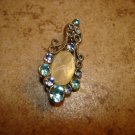 Delicate silver metal button with light blue rhinestones. Delicate silver metal button with light blue rhinestones.