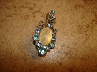 Delicate silver metal button with light blue rhinestones.
