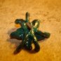 Pewter flower shape painted metal button with rhinestones.