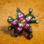 Pewter flower shape painted metal button with rhinestones.
