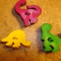 Lot of 3 plastic realistic dinosaurs buttons.