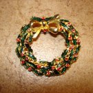 Christmas wreath BROOCH pin with tiny red rhinestones. Christmas wreath BROOCH pin with tiny red rhinestones.