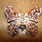 Large pierced metal butterfly button with tiny rhinestones.