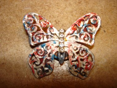 Large pierced metal butterfly button with tiny rhinestones.