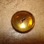 Old metal button with Statue of Liberty.