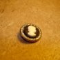 Vintage metal button cameo style.