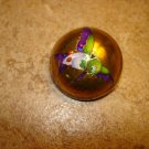 Dome shape gold metal button with humminbird.