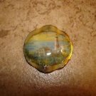 Large gold metal button with lighthouse and house. Large gold metal button with lighthouse and house.