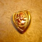 Heart shape gold metal button with lion.