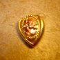 Heart shape gold metal button with lion.