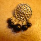 Silver metal button with black beads. Silver metal button with black beads.
