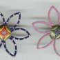 Set of 2 vintage flower shape art deco buttons.