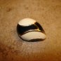 Metal black and white art nouveau button.