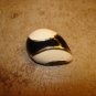 Metal black and white art nouveau button.