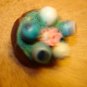 Leather like button with bluberries and flower.