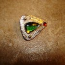Triangle shape silver metal button with green and red stone.