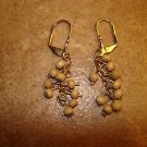 Vintage gold metal earings with wooden beads.