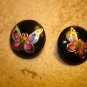 Lot of 2 black  plastic buttons with colorful butterflies.