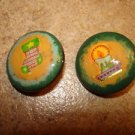 Set of 2 Christmas buttons with Christmas stocking and candle. Set of 2 Christmas buttons with Christmas stocking and candle.