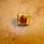 Vintage gold metal button with glass bead.