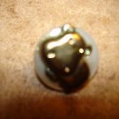 Mother of pearl button with silver metal rhino animal. Mother of pearl button with silver metal rhino animal.