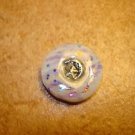 Mother of pearl button with silver metal moon and star. Mother of pearl button with silver metal moon and star.