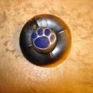 Black plastic button with bear paw. Black plastic button with bear paw.