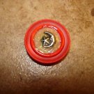 Red plastic button with silver metal moon and star. Red plastic button with silver metal moon and star.