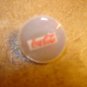Mother of pearl advertising button for Coca Cola.