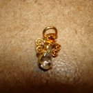 Delicate gold metal button-pendant with tier shape rhinestone.