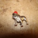 Tiny metal button with buldog dog in red hat. Tiny metal button with buldog dog in red hat.