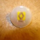 Mother of pearl advertising button for Renault car. Mother of pearl advertising button for Renault car.