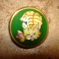 Large dome shape metal button with cat and butterfly.