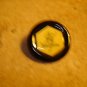 Large plastic advertising button for Mellona honing bee honey.