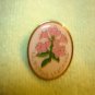 Oval shape gold metal cloisonne pin back pin  with pink flowers.