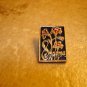 Gold tone all metal MAPMA brooch pin badge with flowers