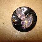 Large black plastic button with glass beads & rhinestones.
