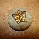Vintage cloth and metal button with butterfly.