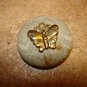 Vintage cloth and metal button with butterfly.